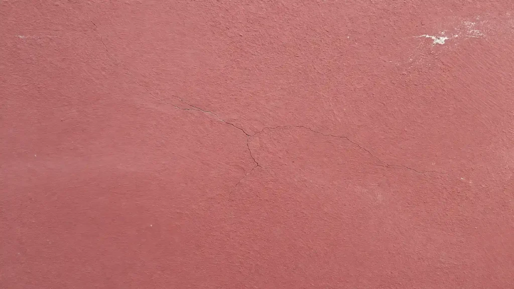 exterior wall paint surface with fine crack