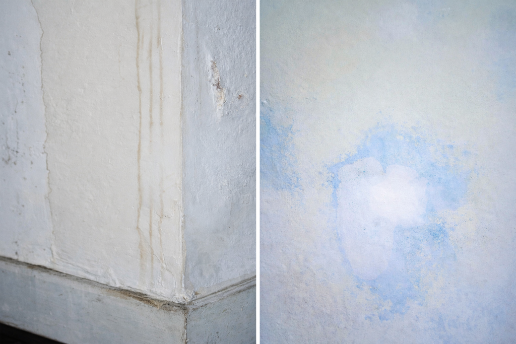 Old wall surface showing patchy coverage and stains that are difficult to hide before repainting